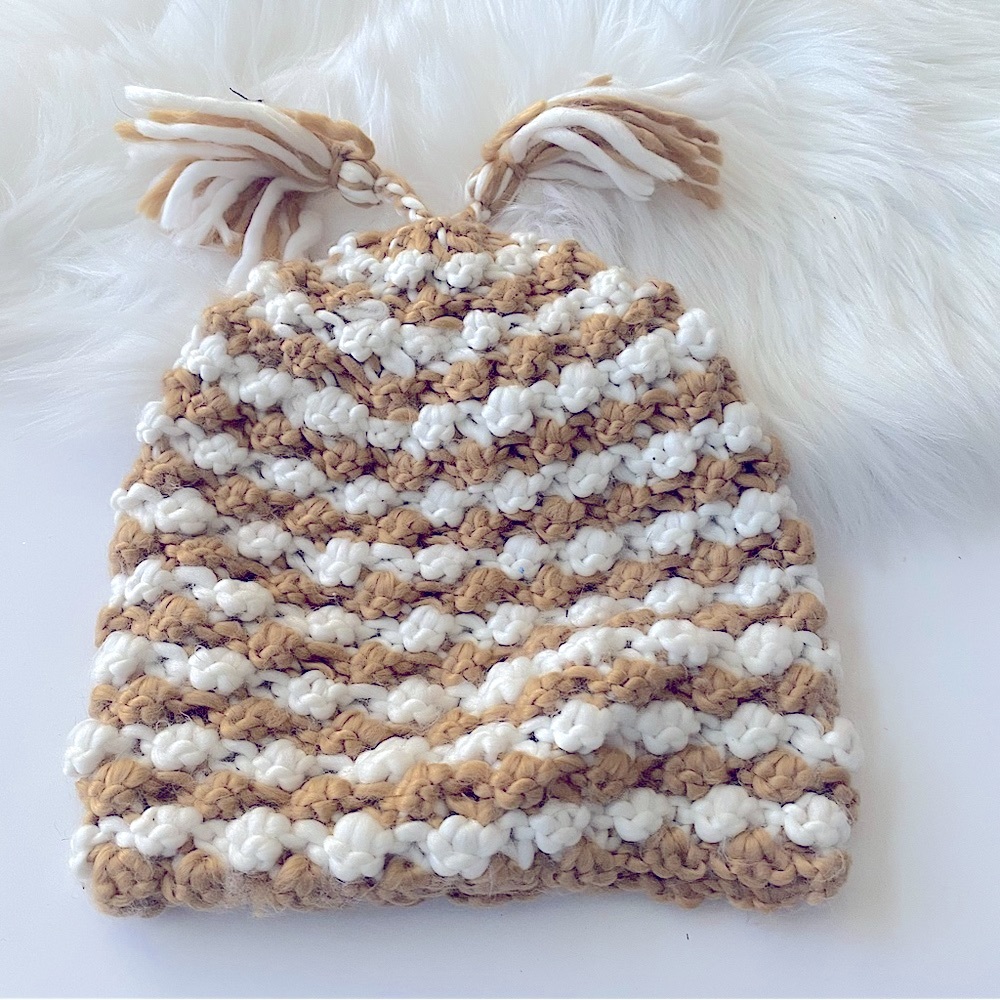Liz Claiborne gold and white crochet hat with two crochet strands on top!